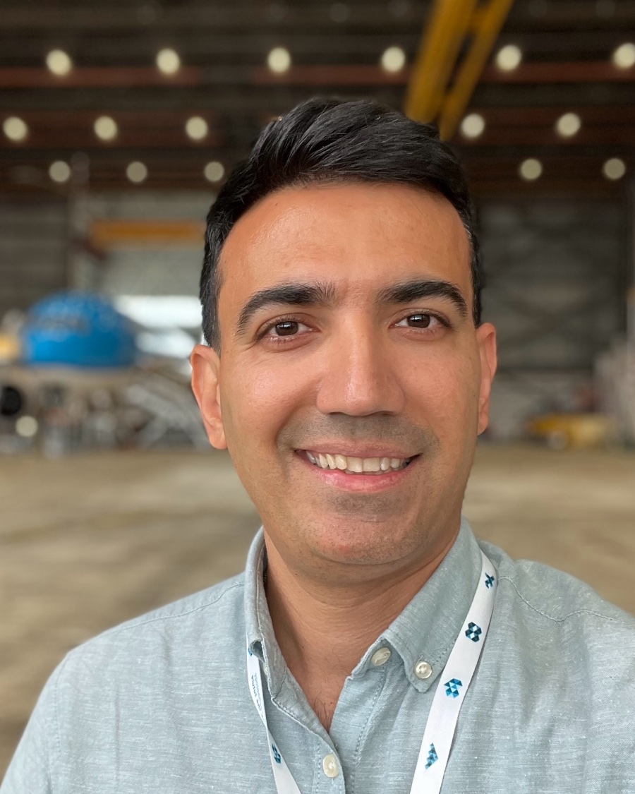 Mo Gharari, Lead iOS Engineer, in an aircraft hangar